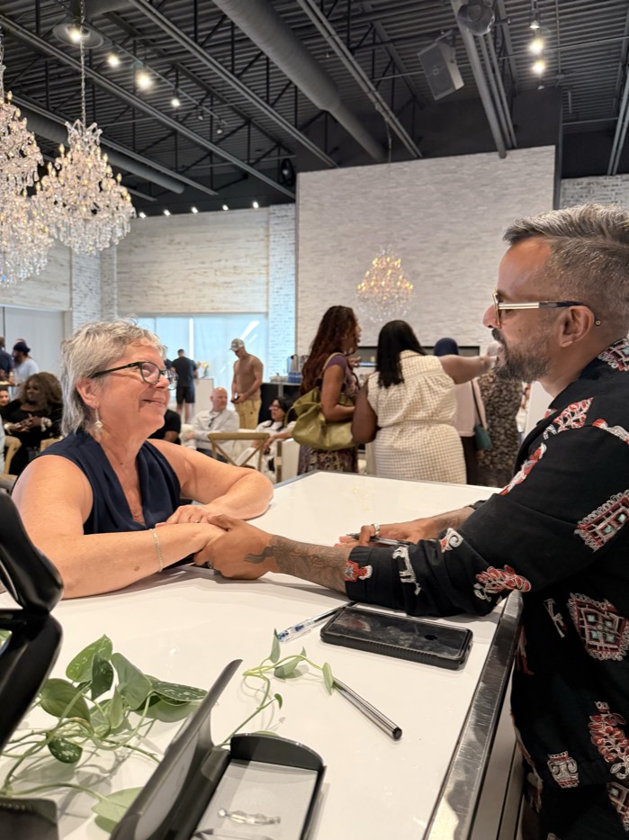 jeewan chanicka sharing a warm moment with a reader at the book signing